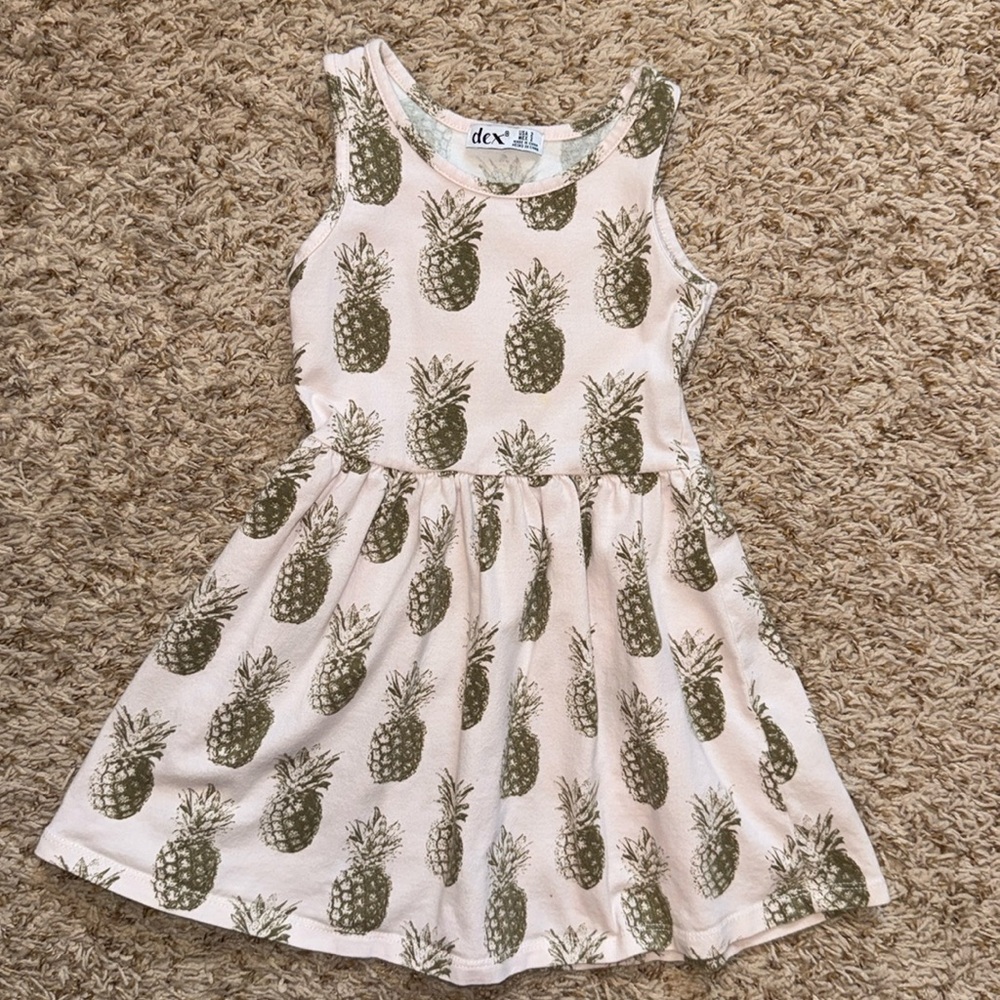 2t girls sleeveless pale pink dress with pineapple print throughout.